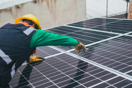 Solar Technician Installing Solar Panel