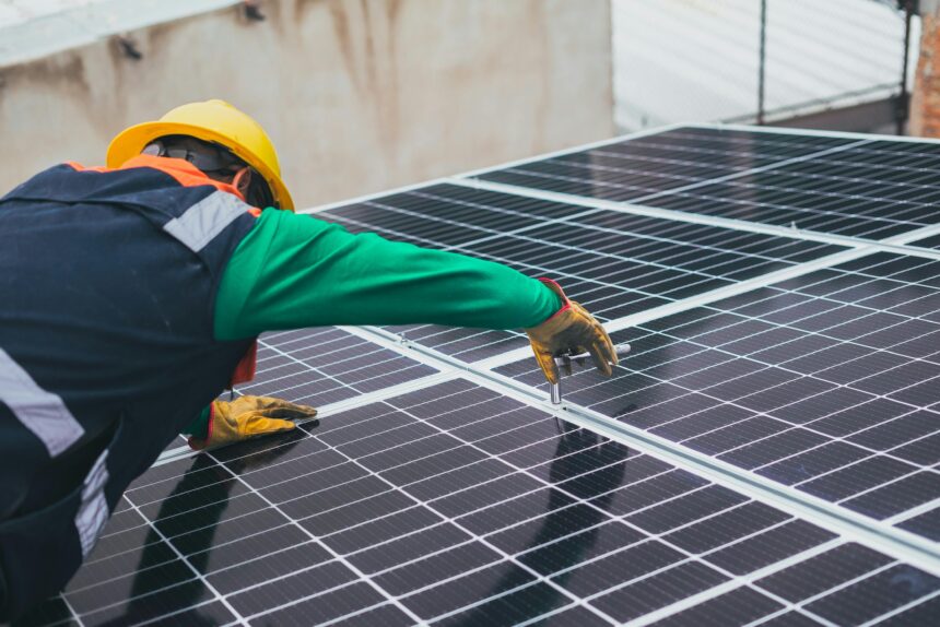 Solar Technician Installing Solar Panel