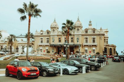 Luxury cars parek in front of a nice hotel in Monte Carlo