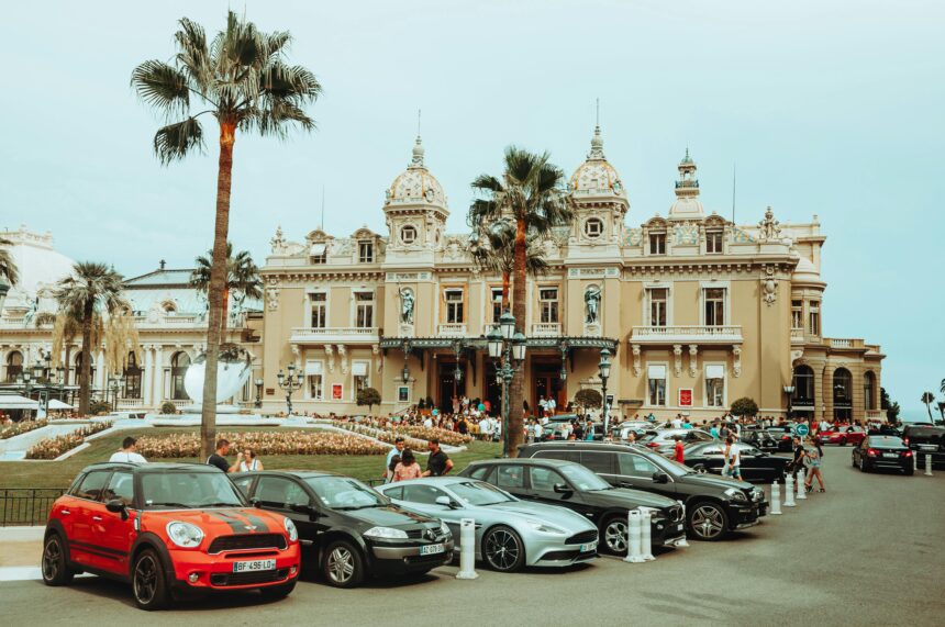 Luxury cars parek in front of a nice hotel in Monte Carlo