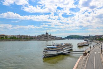 Cruise Ships on River in City