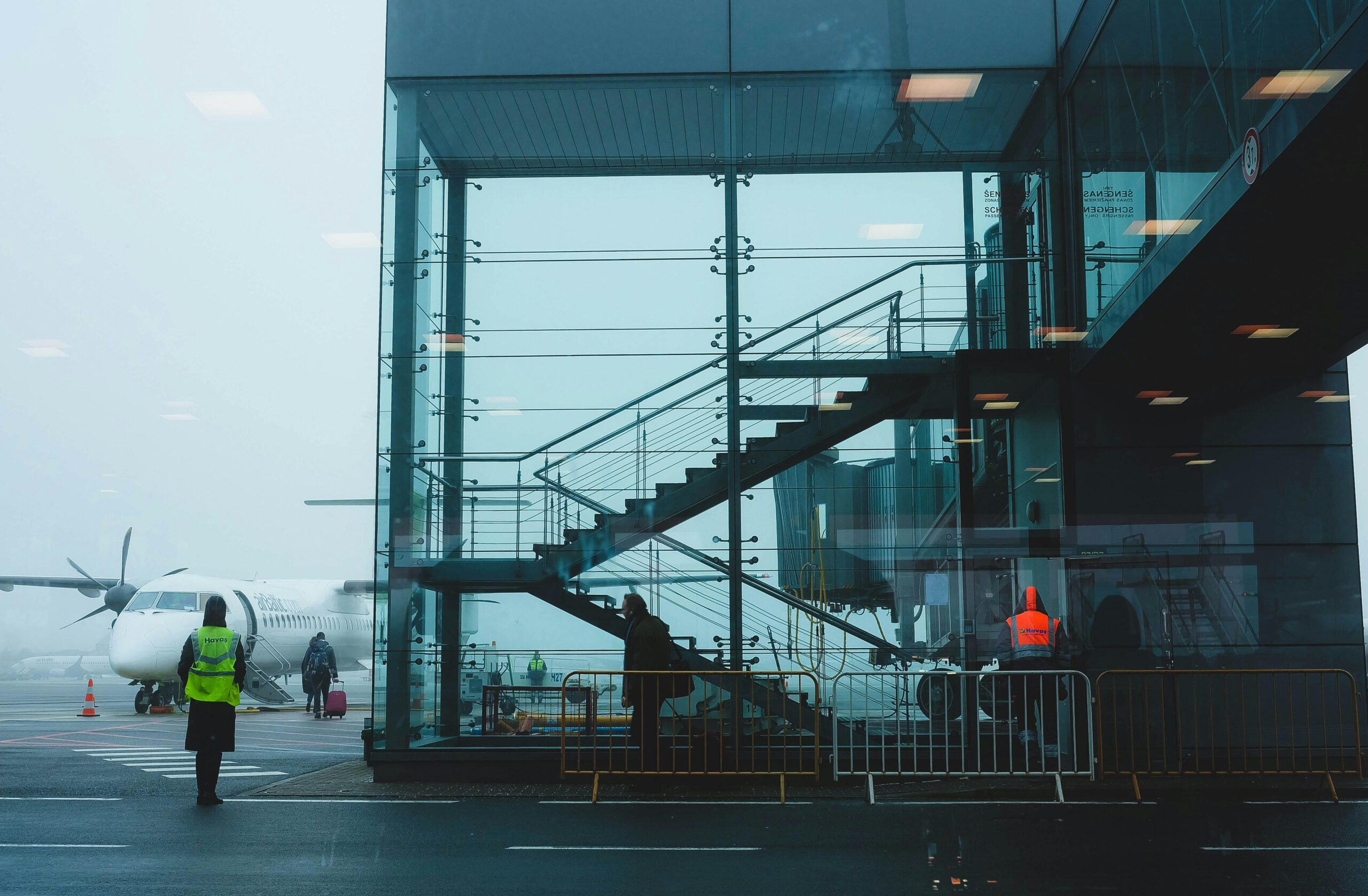 Photo of Glass Building Near Airplane