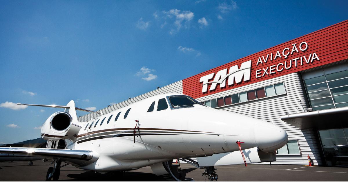 Aircraft outside of TAM building, blue skies in the background.