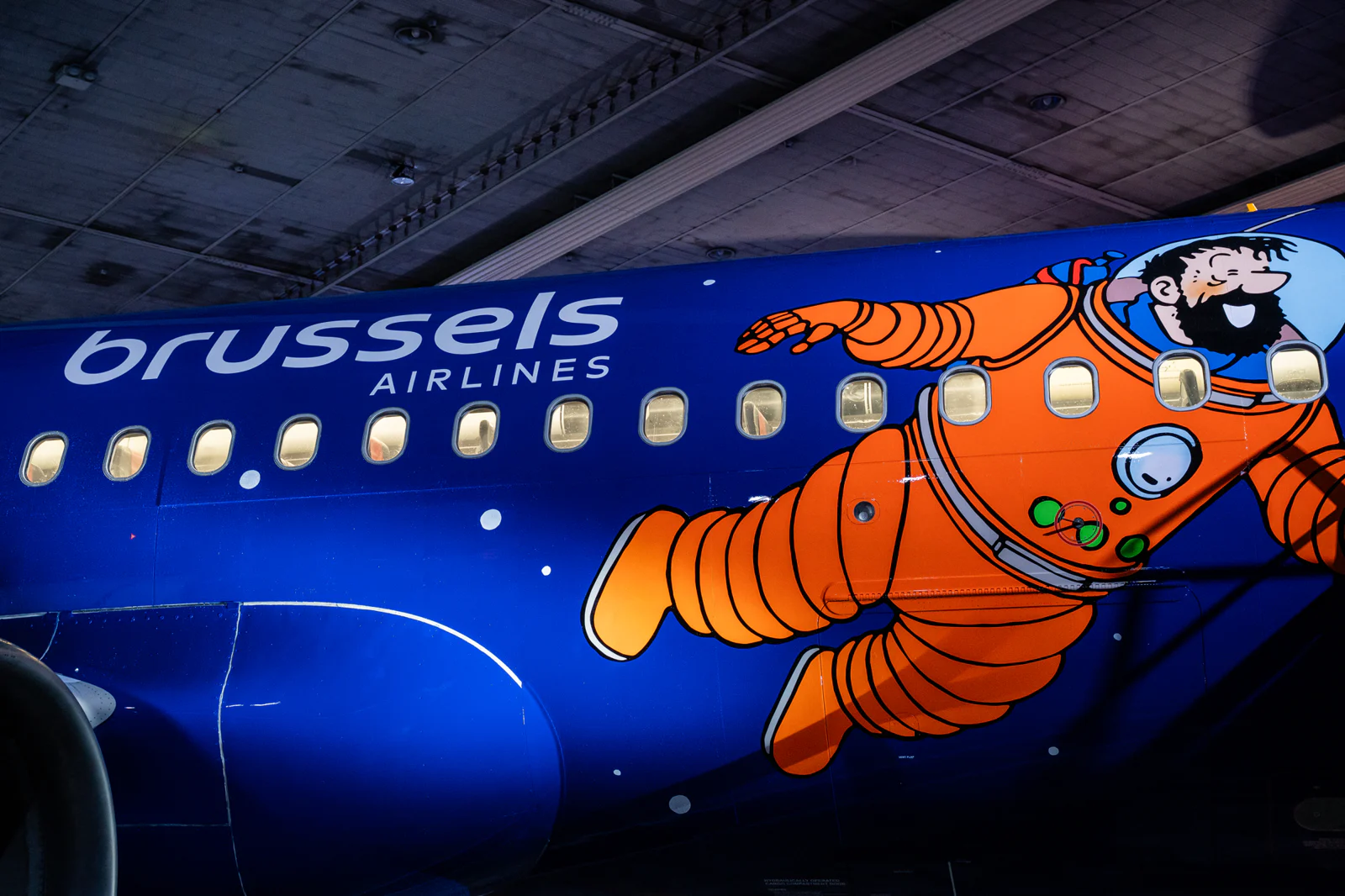 The fuselage of the Airbus A320 depicts the characters in space suits