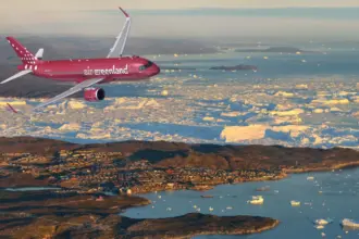 Illustrated of an Air Greenland Airbus, flying over land and water.