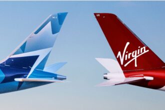 Two aircraft's tails with both Virgin Atlantic and WestJet's logos