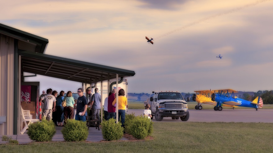 People waiting outside of Westport Airport on late afternoon