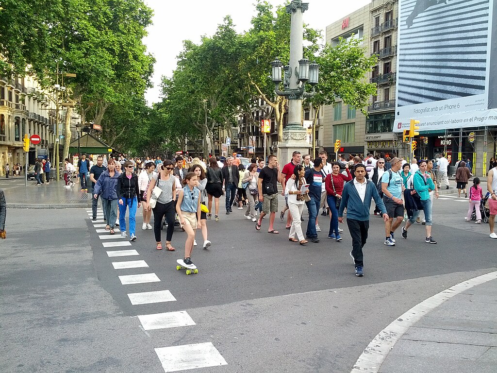 Busy crosswalk at Paca de Cataluny in Spain.