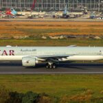 A Qatar Airways aircraft taxiing in the runway