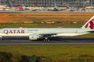 A Qatar Airways aircraft taxiing in the runway
