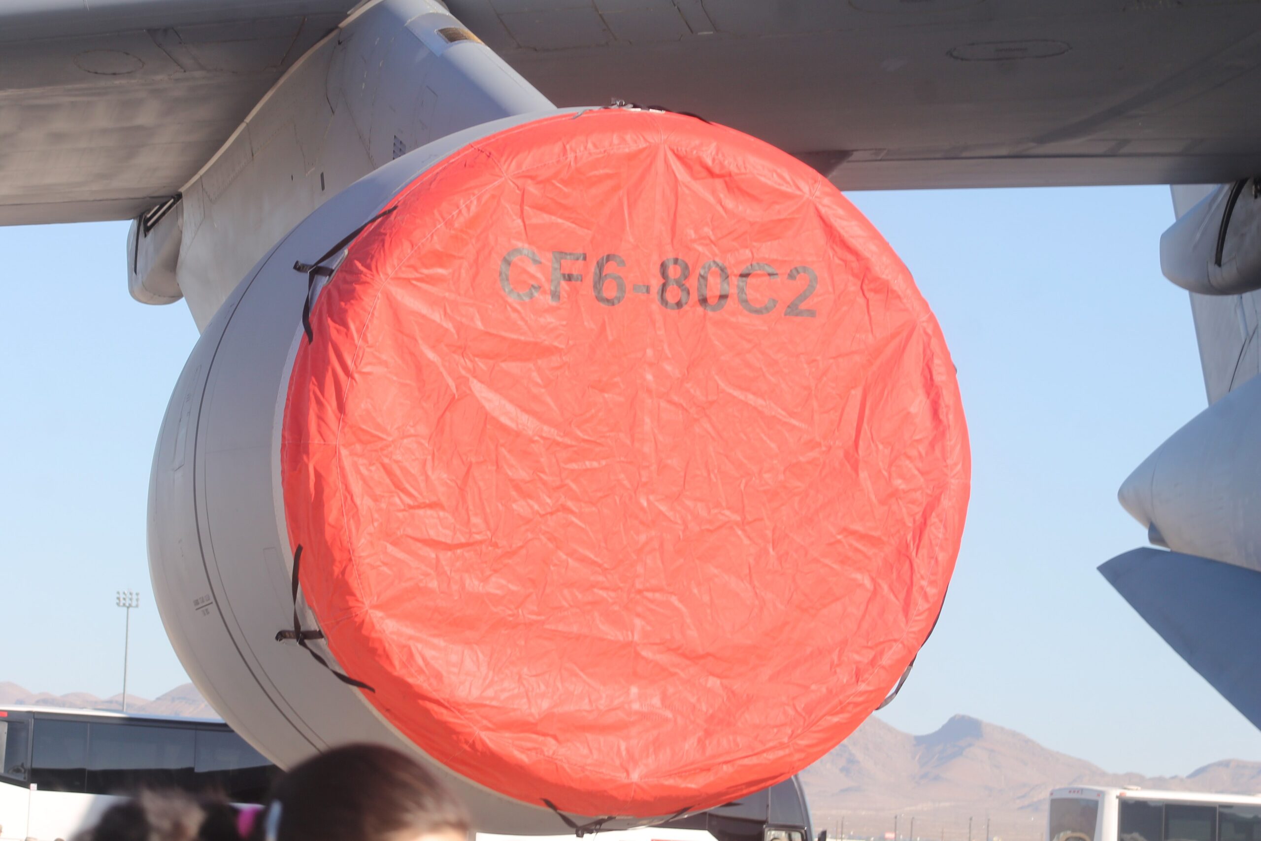 Close up shot of C-5 Galaxy CF6-80C2 Engine covered by a red tarpaulin