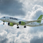 airBaltic airbus A220-300 in flight.