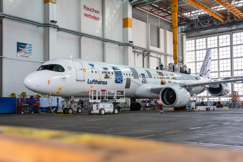 Lufthansa plane in full showing all the designs, in a warehouse.