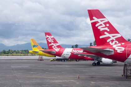 wide-angle shot features three aircraft parked on a tarmac at Kalibo International Airport (KLO) in the Philippines