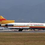 An image of an Air Vietnam (Hàng Không Việt Nam) Boeing 727-100 (registration XV-NJB) parked on the runway.