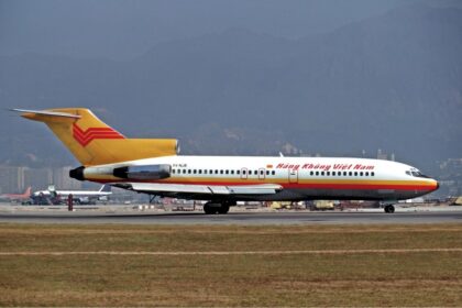 An image of an Air Vietnam (Hàng Không Việt Nam) Boeing 727-100 (registration XV-NJB) parked on the runway.