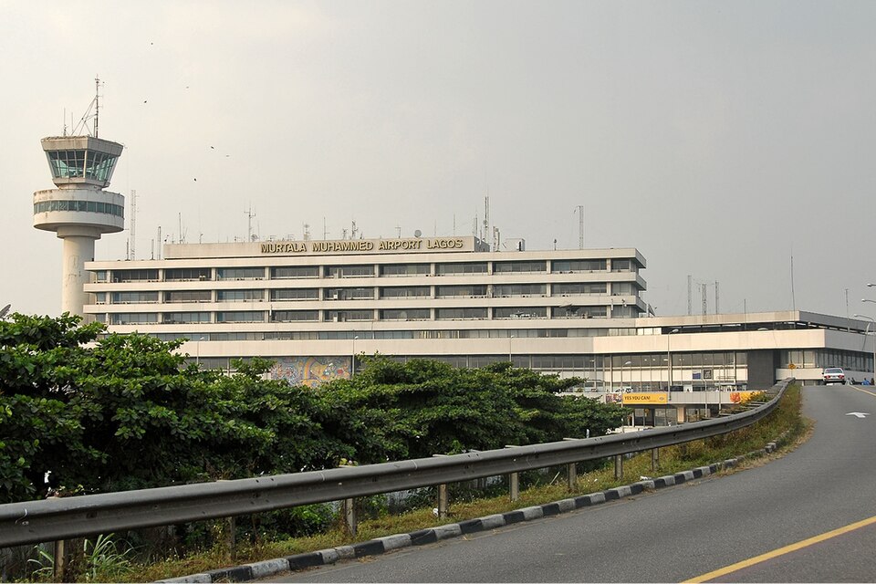 External view of the Murtala Muhammed International Airport (LOS) terminal in Lagos, Nigeria, under a hazy sky