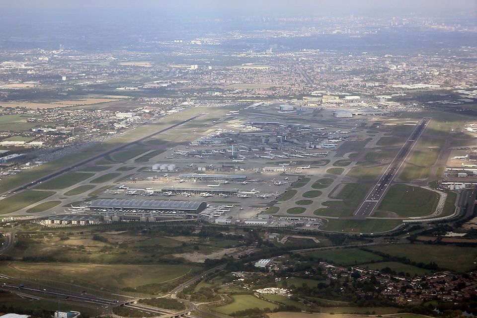 Overview of London Heathrow Airport taken in 2009 on a sunny day highlightinh the runways and aeroplanes.