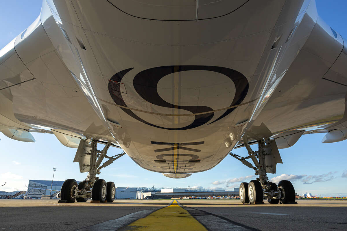 The underbelly of a Korean Air A350 plane, displaying the new Korean Air logo, which uses the Taegeuk (yin and yang) symbol 