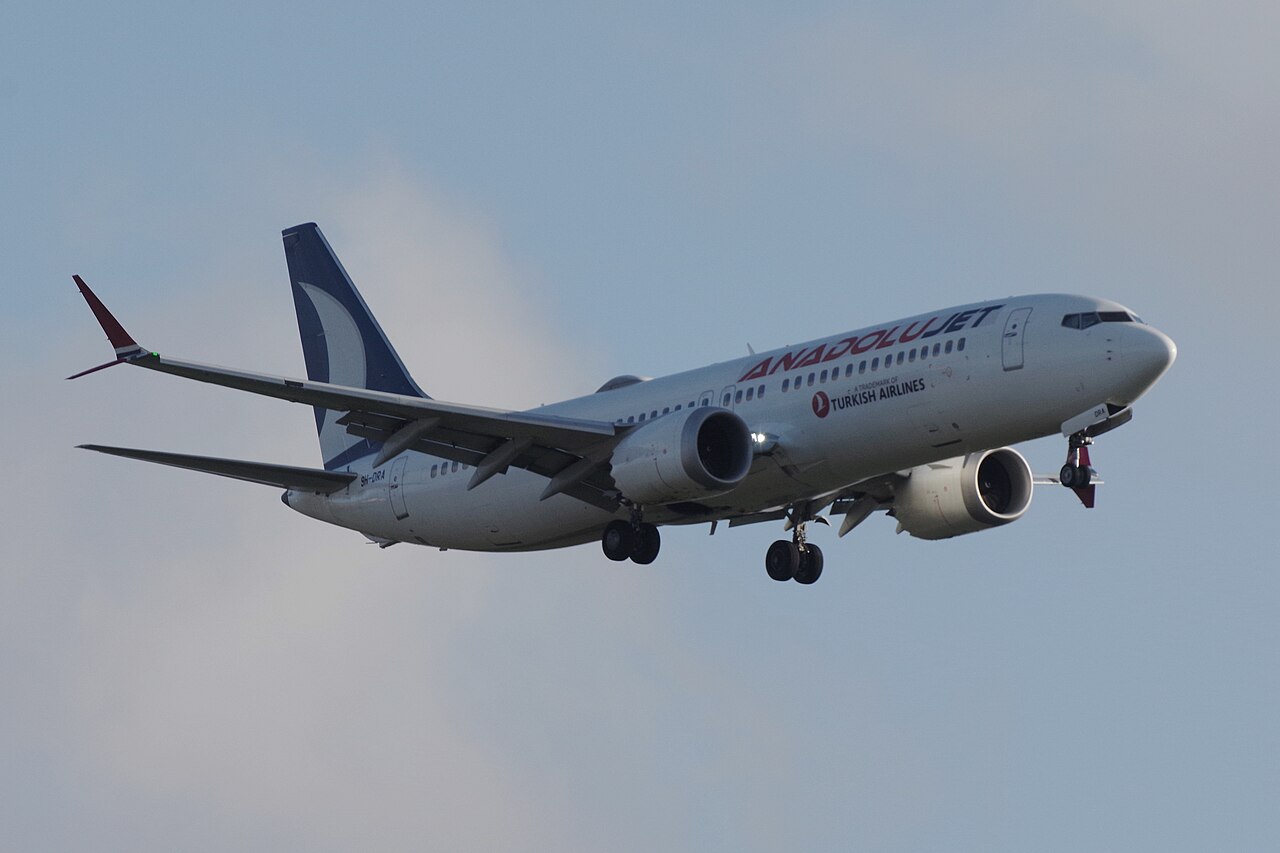Boeing plane in the sky photographed from the side