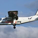 Air Alderney plane mid air photographed from the side.