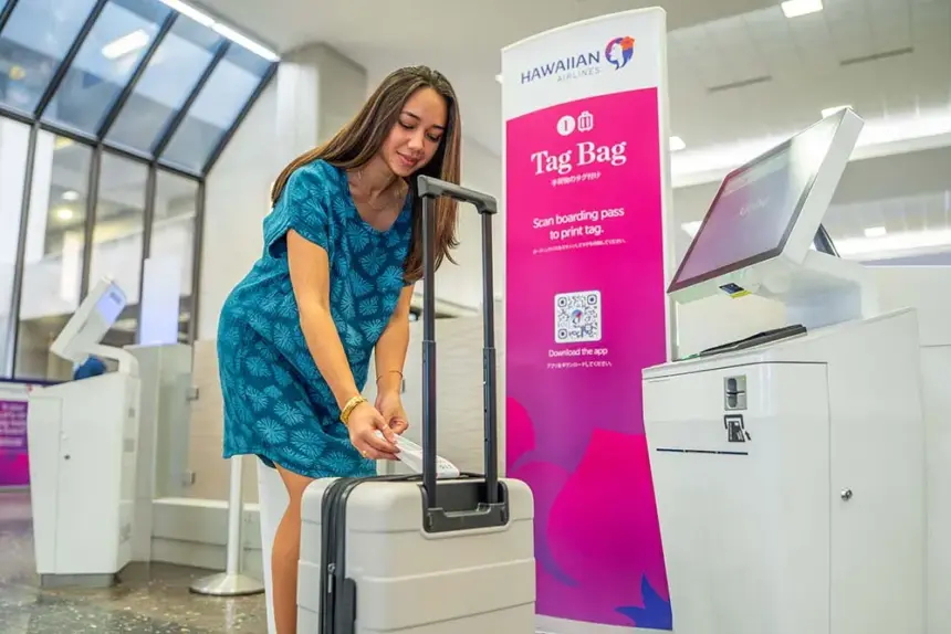 lady checking in her bag with new bag tag station