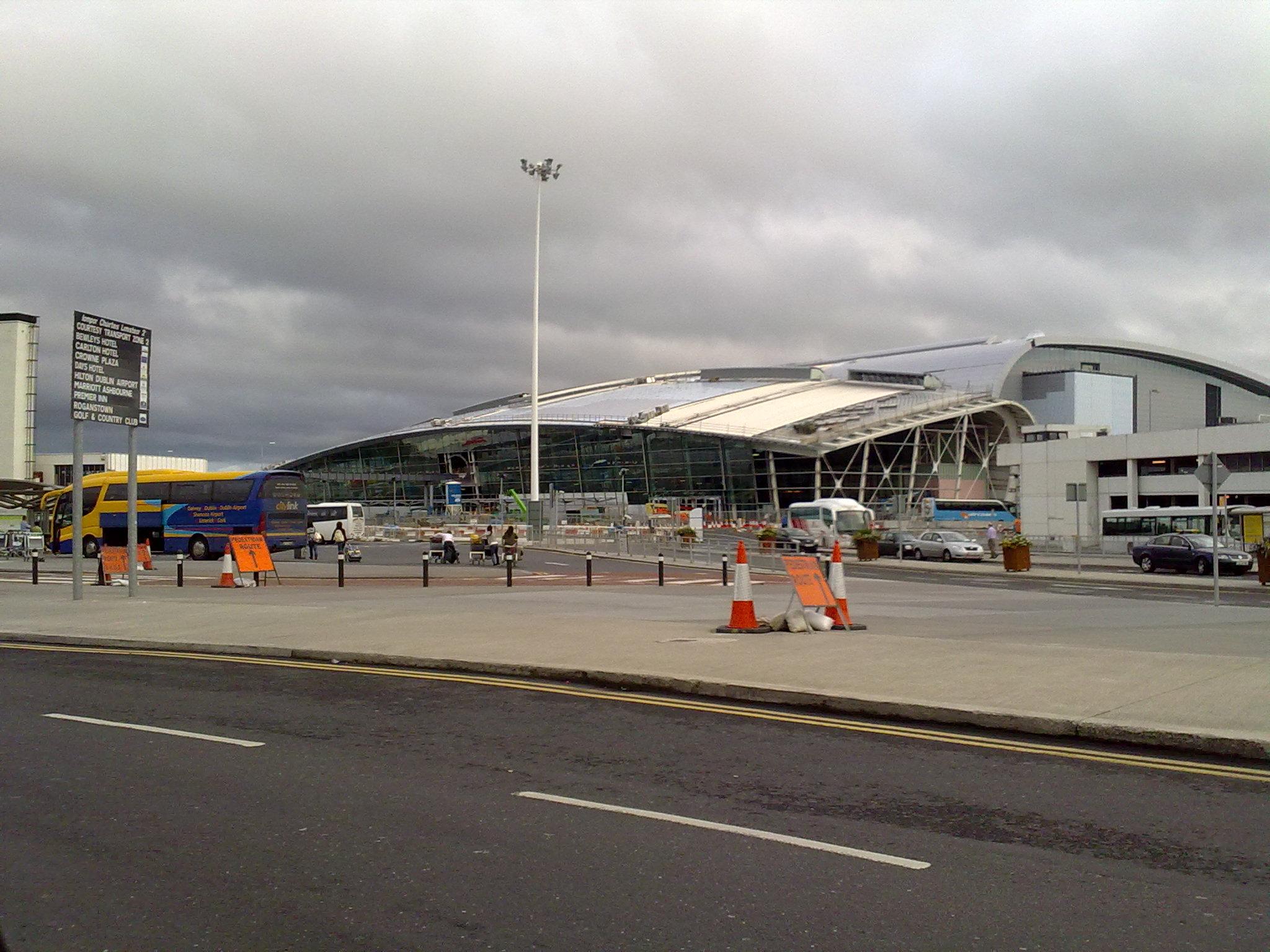 View from the road of the Dublin Airport Terminal 2; cloudy sky.