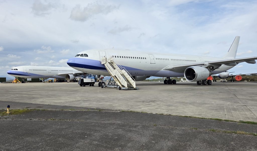 EirTrade facility in Knock with planes on the ground and steps leading up to the door.