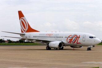 GOL Airlines Boeing 737-700 aircraft on the tarmac. White and orange livery.