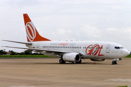 GOL Airlines Boeing 737-700 aircraft on the tarmac. White and orange livery.