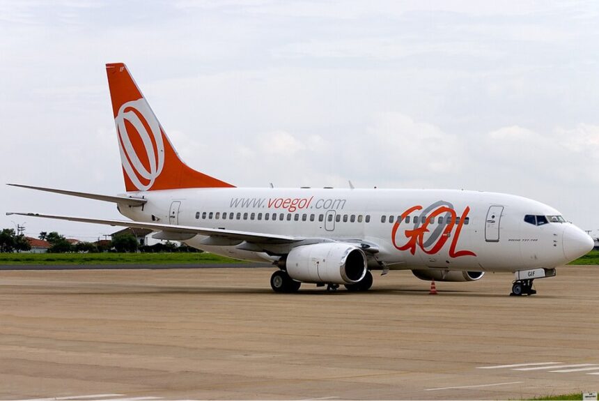 GOL Airlines Boeing 737-700 aircraft on the tarmac. White and orange livery.