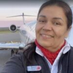 Solange Tremblay Standing at the side of an aircraft