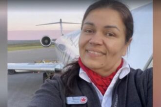 Solange Tremblay Standing at the side of an aircraft