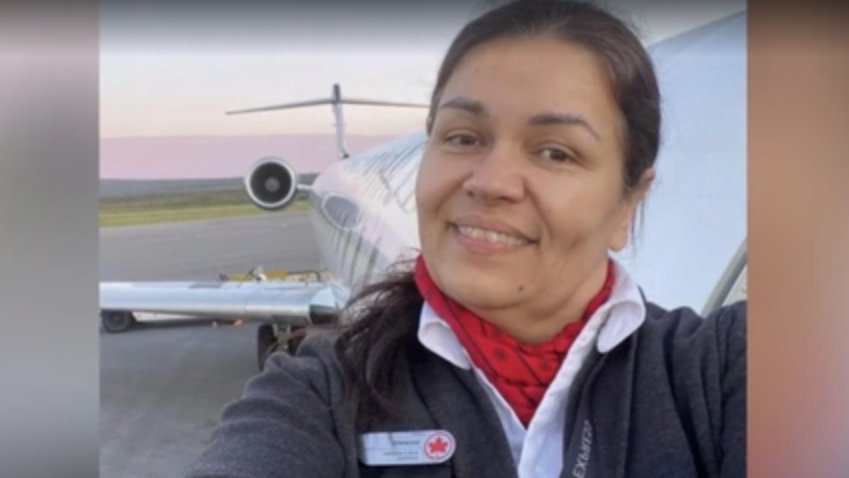Solange Tremblay Standing at the side of an aircraft