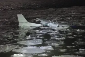 The Cessna 172 submerged in the Hudson River amid ice.