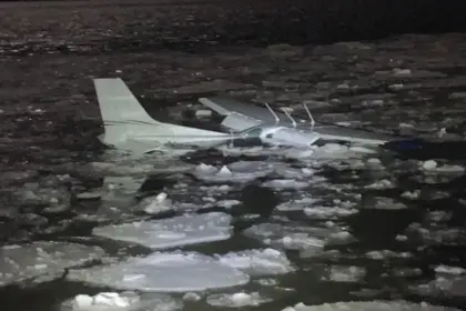 The Cessna 172 submerged in the Hudson River amid ice.
