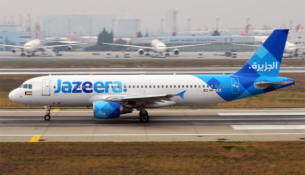 Jazeera Airways Airbus aircraft, on runway about to takeoff.