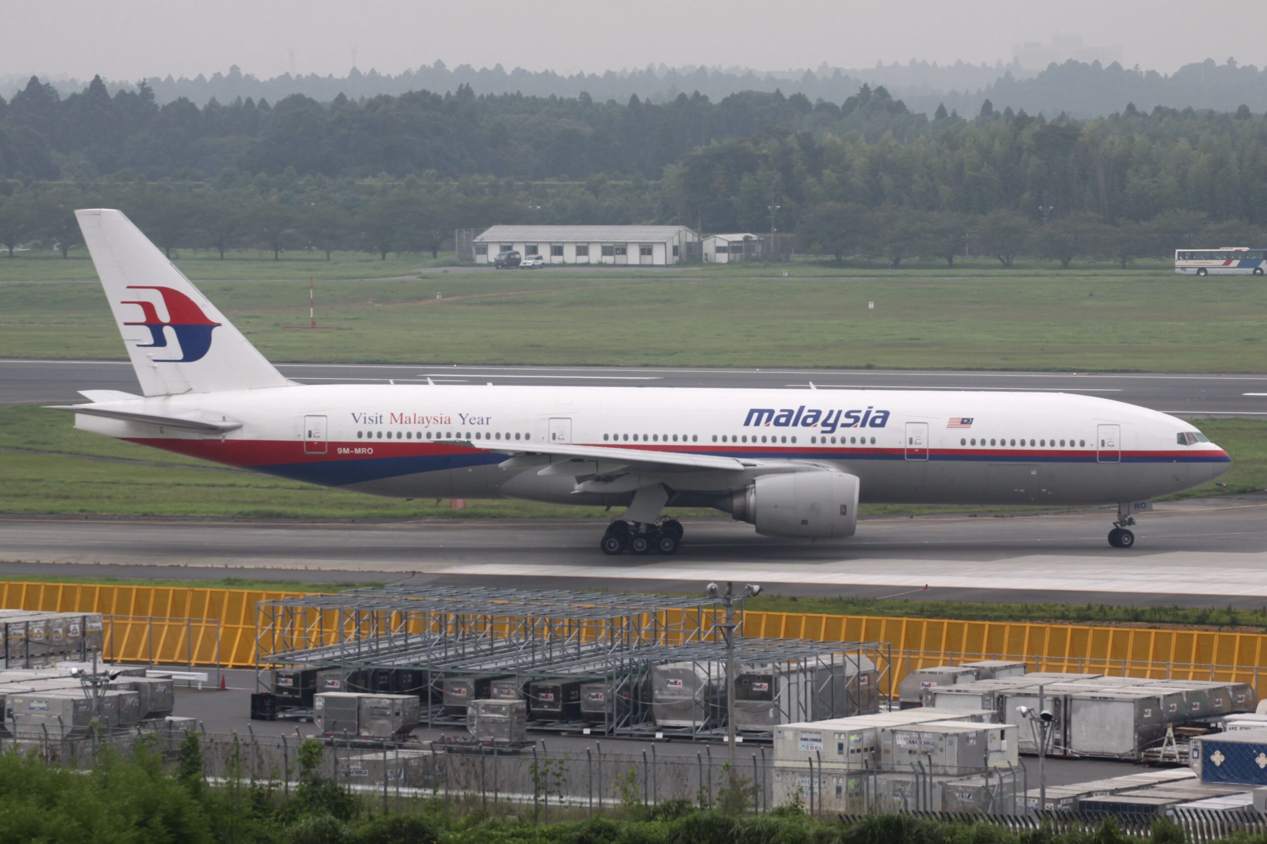 Malaysia Airlines B777-200ER aircraft on the runway at Narita International Airport, Tokyo.