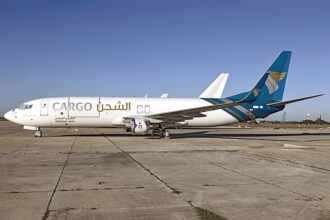 Oman Air Cargo, Hondo 12-07-25 on runway, plane facing left of image