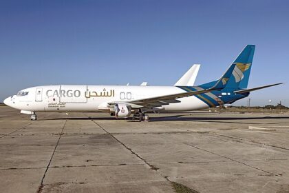 Oman Air Cargo, Hondo 12-07-25 on runway, plane facing left of image
