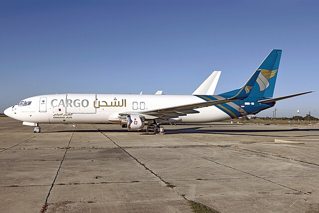 Oman Air Cargo, Hondo 12-07-25 on runway, plane facing left of image