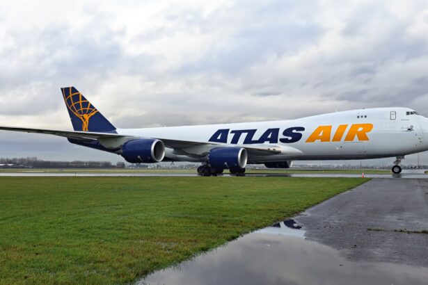 Atlas Air Boeing 747-8F on the runway surrounded by grass.