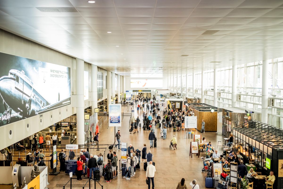 Passengers walking in Brussels Airport's departure hall