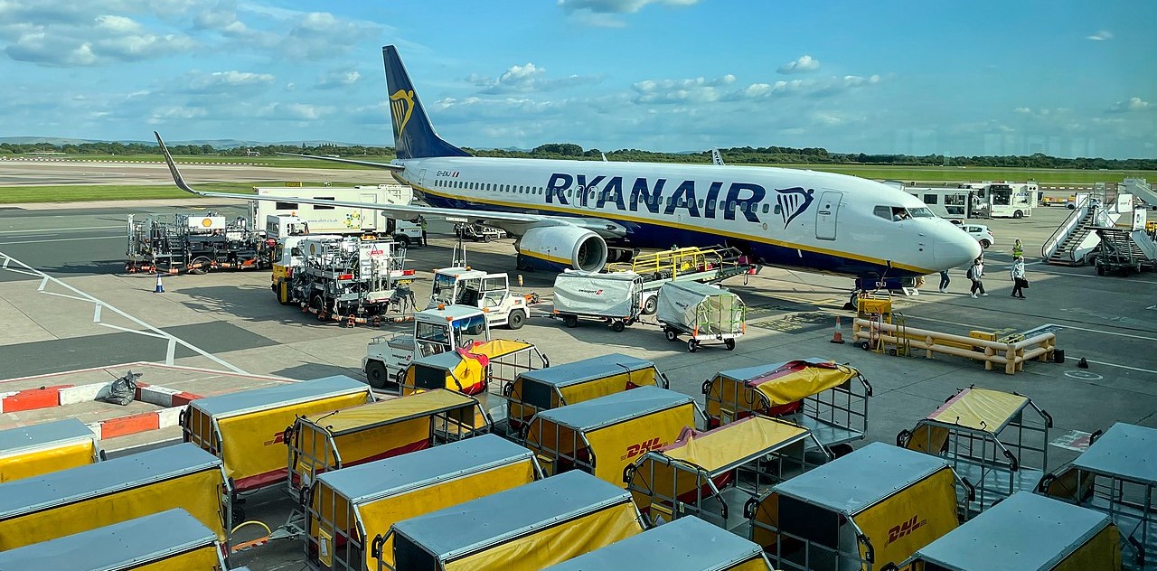 Ryanair aircraft at Manchester Airport, parked on the apron.