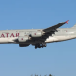 Qatar Airways Airbus A380 aircraft flying with the blue sky in the background.