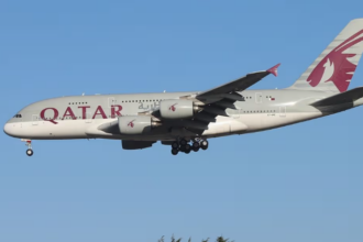 Qatar Airways Airbus A380 aircraft flying with the blue sky in the background.