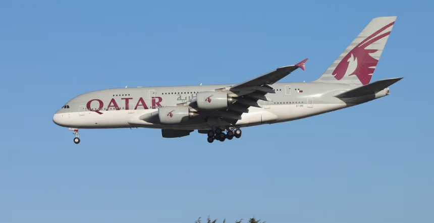 Qatar Airways Airbus A380 aircraft flying with the blue sky in the background.