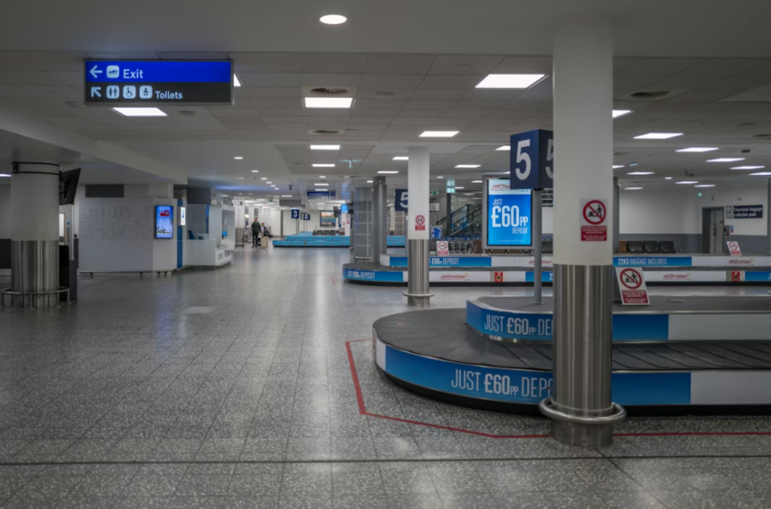 An empty airport baggage claim area with conveyor belts