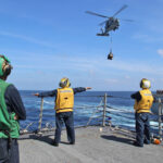 US Navy sailors on USS Kidd preparing helicopter operations during MH370 search in Andaman Sea