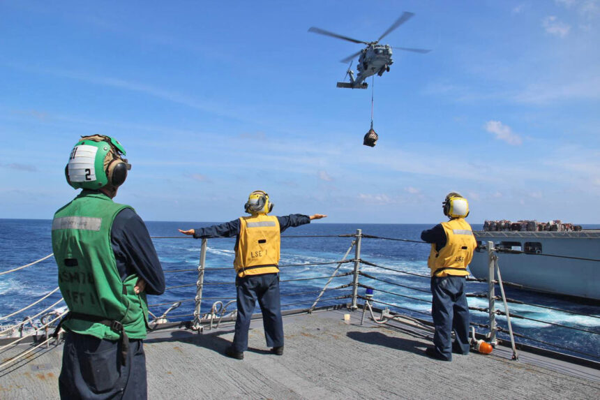 US Navy sailors on USS Kidd preparing helicopter operations during MH370 search in Andaman Sea